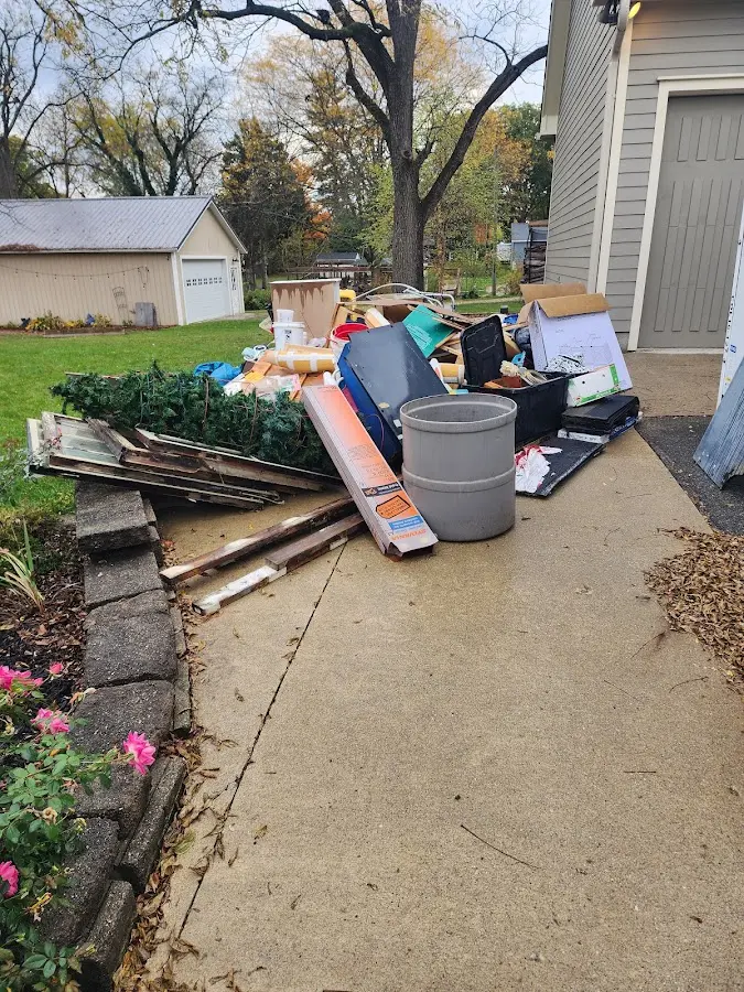 Dumpster being loaded with debris for Commercial Dumpster Rental in Bluefield